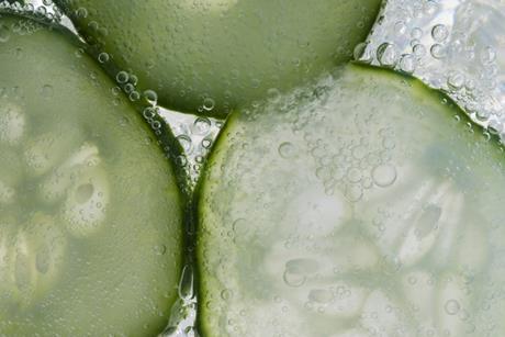 Cucumber in tonic bubbles, close-up