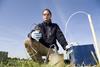 A man using equipment to test the soil