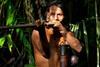 Huaorani hunter using a traditional blowpipe