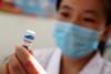 A photograph of a nurse preparing a vaccination shot against rabies at the Disease Control and Prevention Center in Huaibei in China's eastern Anhui province