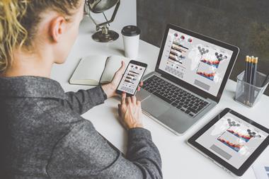 Woman looking at data on computer from Shutterstock