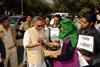 An image showing Jairam Ramesh interacting with protesters as he arrives for the genetically modified BT Brinjal Consultancy program in Ahmedabad on January 19, 2010