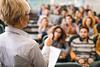 An image showing a university professor giving lecture