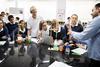 Enthralled students watch a science experiment