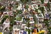 An image showing flowers seen placed on the portraits of the victims of flight PS 752 at the memorial corner of Boryspil International Airport