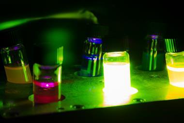 Image of photochemical vials glowing in the dark