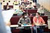 An image showing students in a lecture theatre wearing masks