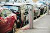 A photos of electric cars at a recharging station