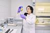 A photo of a woman working in a lab