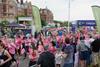 A photo showing runners dressed in pink taking part in a sponsored event for charity