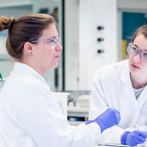 Scientists talking in a laboratory