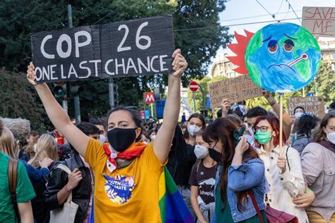 Milano, Italy October 1, 2021: Young people display placards during the march that took place during the Pre-COP Event where the ministers prepare UN COP26 climate change conference.