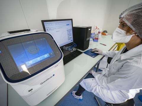 Woman analysing sewage water