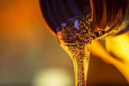 Lubricant oil pouring from a bottle