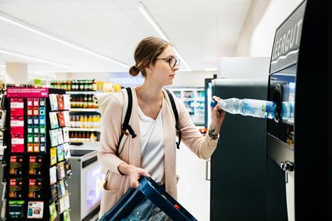 Woman recycling bottles