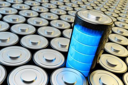 A battery stands above a columns of stacked batteries, displaying full power using five bright blue bars