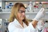 A woman working in a lab